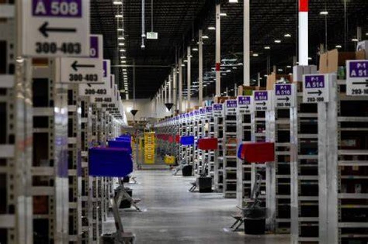 Amazon fulfillment center in Aurora, Colo., Michael Bennet. U.S. Senator Michael Bennet, D-Colo., speaks during a tour of the Amazon fulfillment center, in Aurora, Colo. More than 1,000 full-time associates work in the Aurora facility, which opened in September 2017, and is one of more than 100 such fulfillment centers scattered across North America Amazon Colorado - 03 May 2018