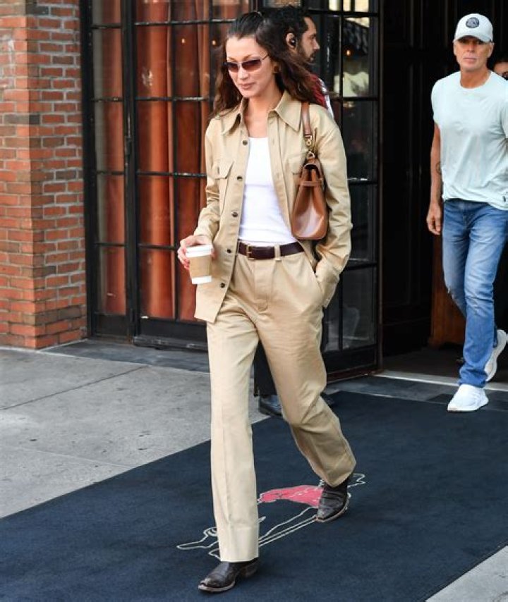 Bella Hadid steps out in Miami in a pair of Dr.Martens boots and a summer dress with friend Hailey Baldwin. The models headed to popular Yardbird for some southern style cooking. Baldwin showed off her long legs and toned stomach in a pair of daisy dukes denim shorts and a crop top.Pictured: Hailey BaldwinRef: SPL1686468 300418 Picture by: Splash NewsSplash News and PicturesLos Angeles:310-821-2666New York:212-619-2666London: