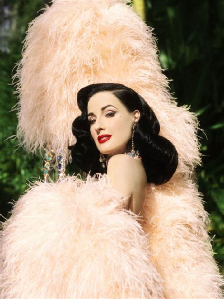 Burlesque dancer Dita Von Teese poses for photographers upon arrival at the premiere of the film 'Rocketman' at the 72nd international film festival, Cannes, southern France 'Rocketman' premiere, 72nd Cannes Film Festival, France - 16 May 2019