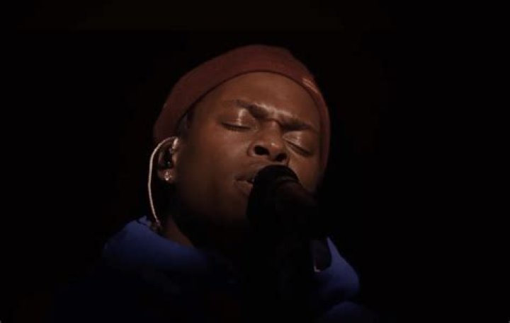 Daniel Caesar shows off his chest