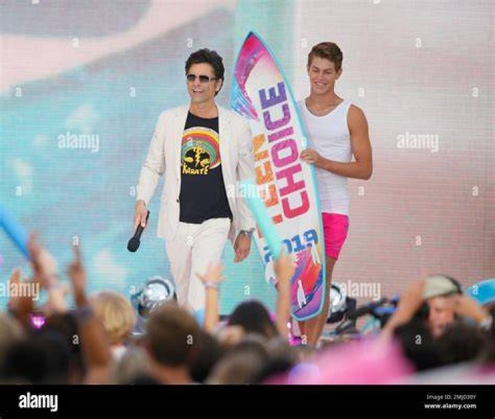 John Stamos presents the choice male web star award at the Teen Choice Awards, in Hermosa Beach, Calif 2019 Teen Choice Awards - Show, Hermosa Beach, USA - 11 Aug 2019