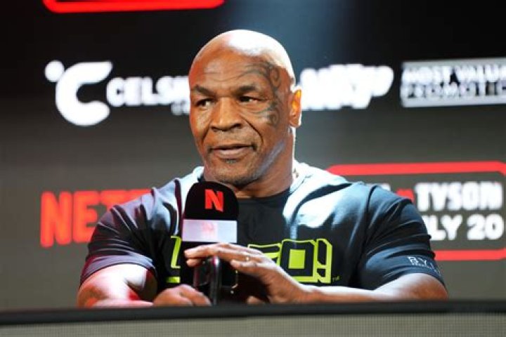 Mike Tyson at the Pre Larry Holmes Weigh In Boxing Promoter Don King in the background Las Vegas 22/1/88 United States Las Vegas Tyson v Holmes Sport