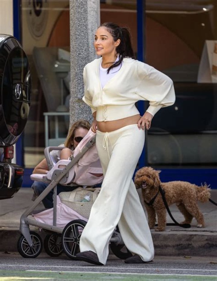 Olivia Culpo Walking In A Feathered Mini Dress