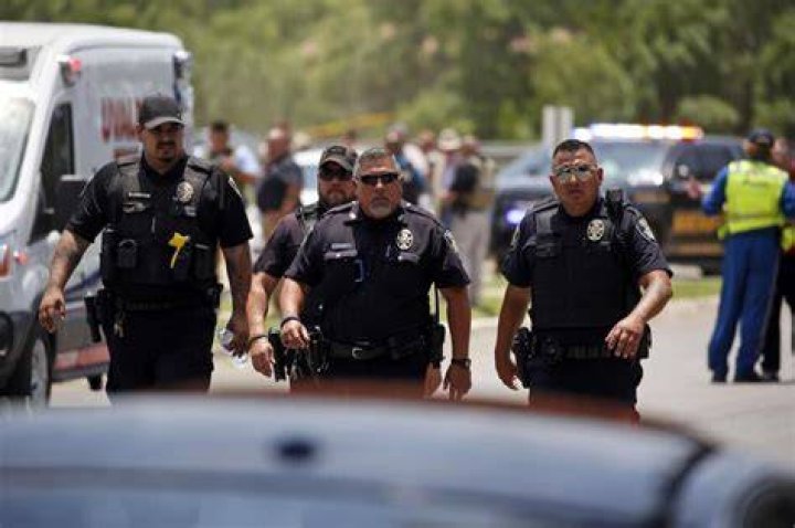 Police walk near Robb Elementary School following a shooting, in Uvalde, Texas Texas School-Shooting, Uvalde, United States - 24 May 2022