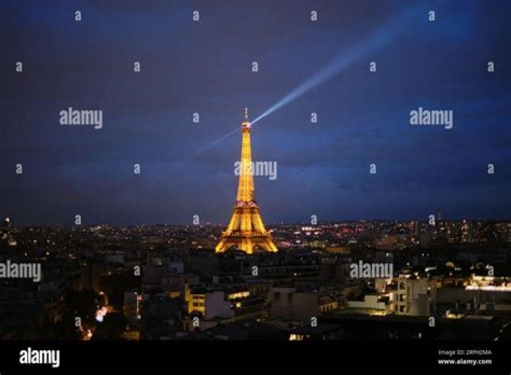 The Eiffel Tower lit up in the red, white and blue of the French flag Tributes to the victims of the Paris terrorist attacks, Paris, France - 18 Nov 2015